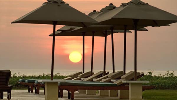 Atas Ombak -  Sunset and umbrellas